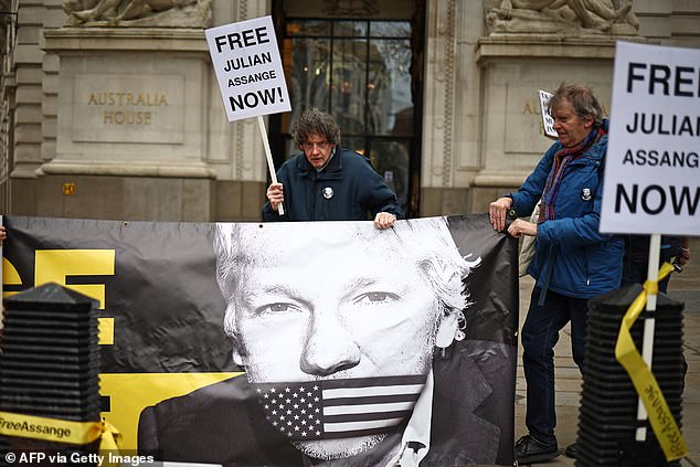 Supporters of Wikileaks founder Julian Assange protest outside the Australian High Commission in central London on Wednesday, on the eve of the fifth anniversary of his arrest by British police.