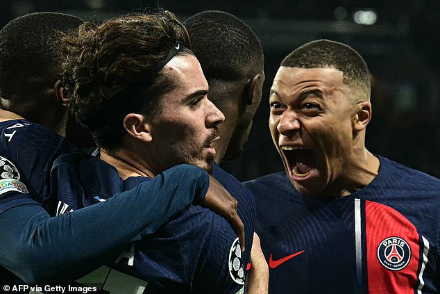 Mbappé (right) celebrates passionately with his teammates after PSG take the lead