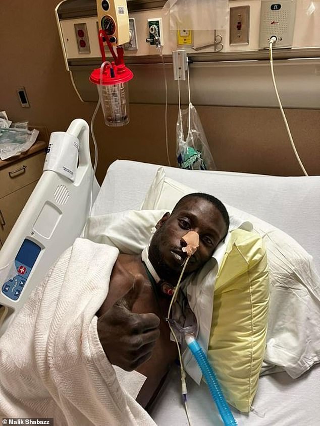 Michael Corey Jenkins in hospital after being shot in the mouth during assault