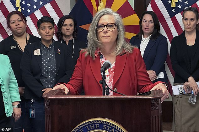 Arizona Democratic Gov. Katie Hobbs speaking to reporters at the state Capitol in Phoenix on April 9 after the state Supreme Court decision. She called the ruling 