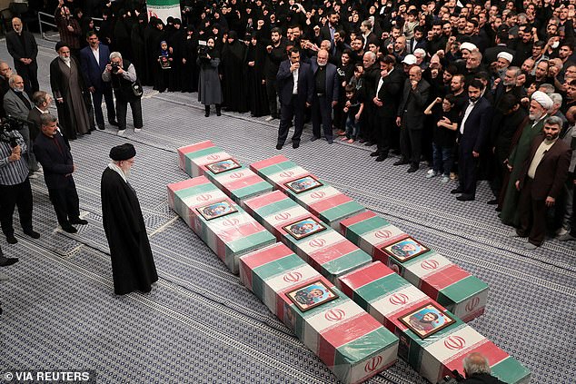 Iran's Supreme Leader Ayatollah Ali Khamenei looks at the coffins of members of the Islamic Revolutionary Guard Corps who were killed in the Israeli airstrike on the Iranian embassy compound in Damascus, the Syrian capital.