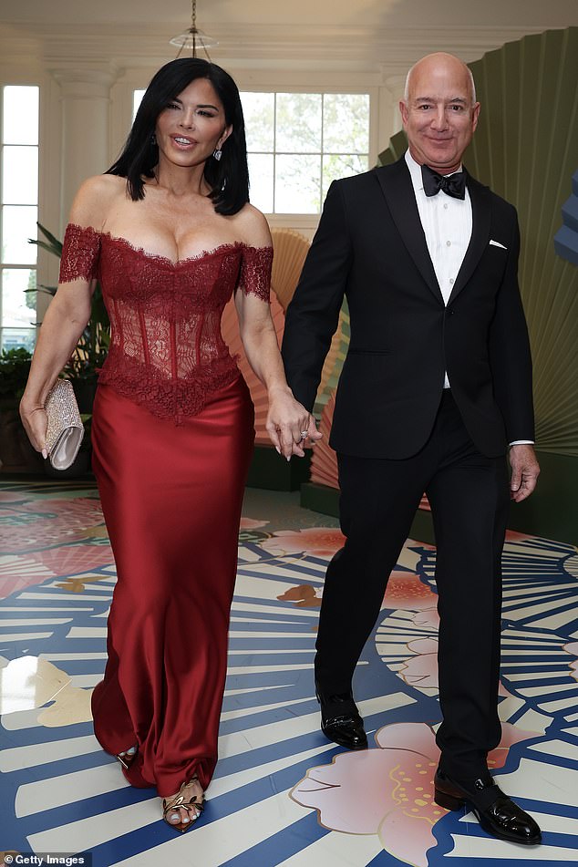 Bezos looked dapper in a black tuxedo as they walked inside to join the likes of Robert De Niro as part of President Biden's state dinner for the Japanese prime minister.