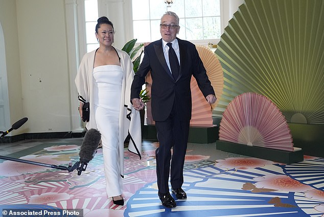 Robert De Niro and Tiffany Chen arrive at the White House Bookstore area for the State Dinner