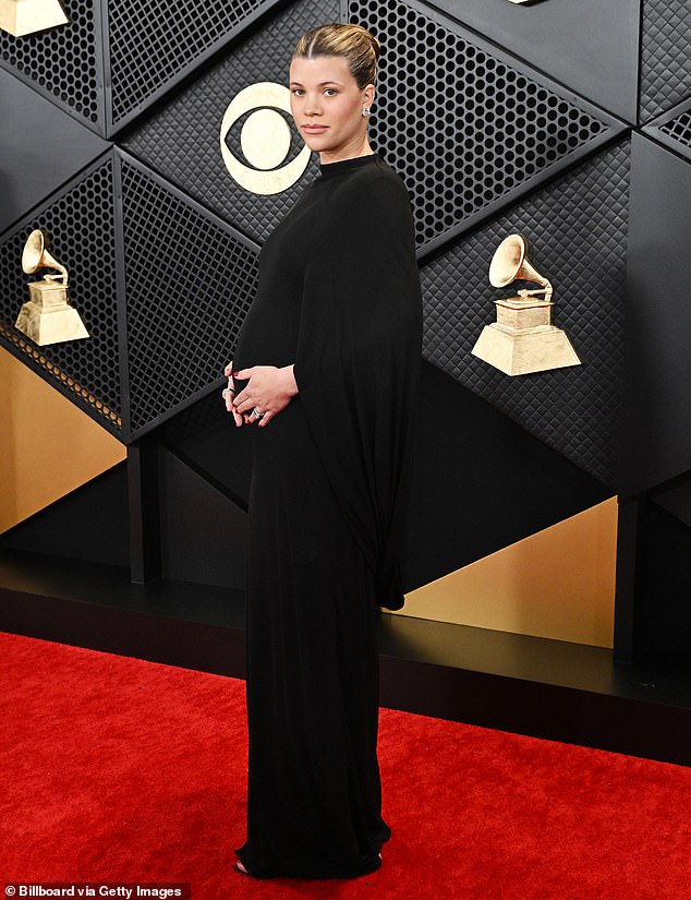 The 25-year-old showed off her baby bump while walking the Grammys red carpet in February.