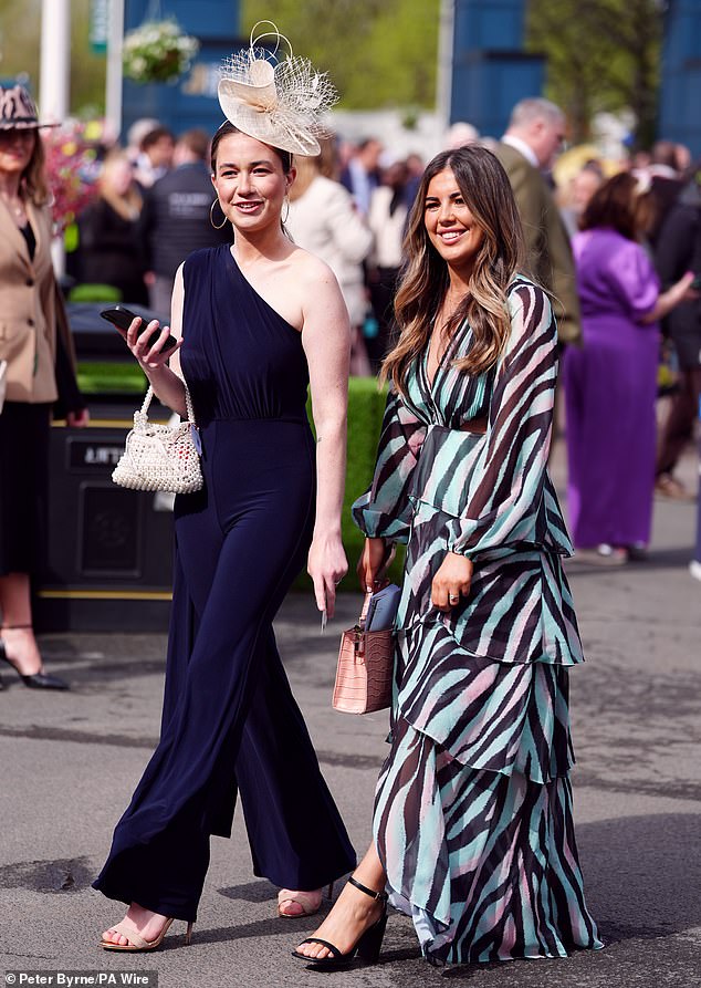 Double trouble!  These fashionable friends seemed delighted to attend today's racing at Aintree Racecourse, Liverpool.