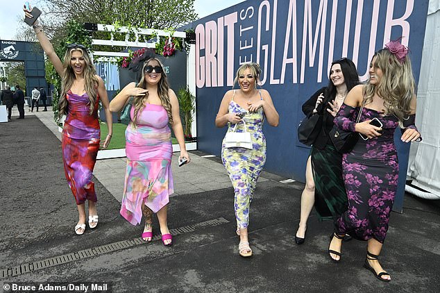 Here come the girls! A group of friends looked ready to enjoy their day off as they showed off their glamorous dresses.