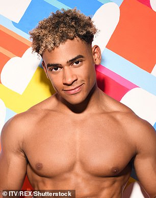 On Love Island in 2019, she sported curly locks and no facial hair, creating a stark contrast.