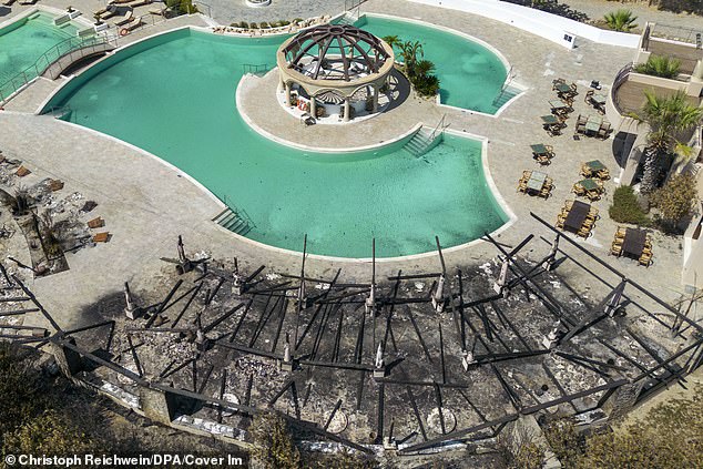 Sun loungers and pool bar at a hotel destroyed by fire in the southeast of the resort island of Rhodes