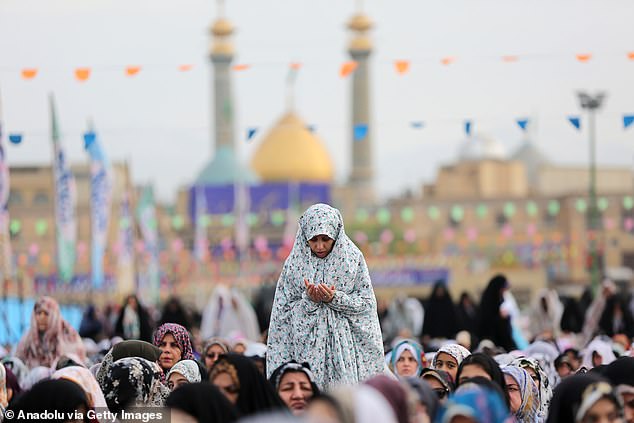Muslims arrive at the Shah Abdol-Azim shrine to perform the Eid al-Fitr prayer marking the end of the fasting month of Ramadan, one of the holiest months in the Islamic calendar, in Tehran