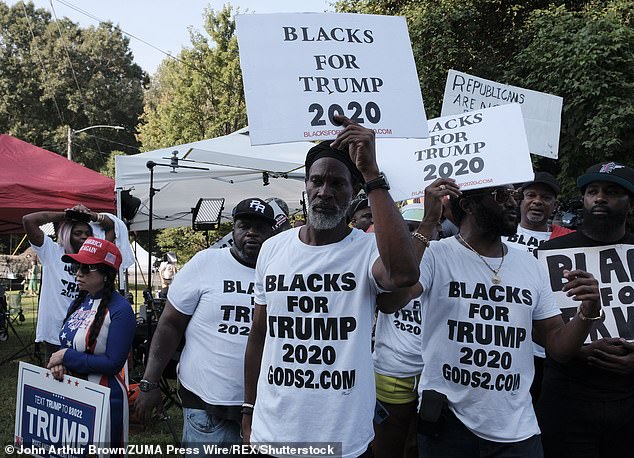 But the separate polls spell trouble for Biden in his 2024 reelection bid, as Black voters in six of seven swing states favor Trump over the incumbent president. Pictured: Members of Blacks for Trump demonstrate outside the Fulton County Jail in Atlanta, Georgia, in August 2023, to support the president as he arrived to turn himself in and have his mugshot taken.
