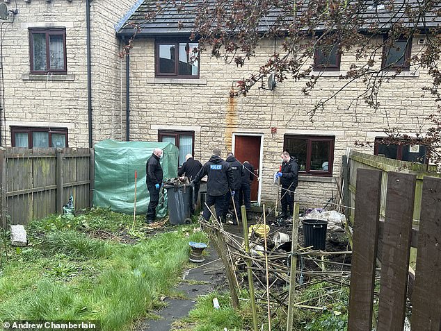 Officers were seen breaking into a housing association property in Burnley on Sunday and conducting an extensive search of the garden on Monday.