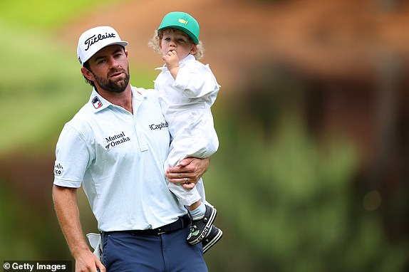AUGUSTA, GEORGIA - APRIL 10: Cameron Young of the United States holds his son, Henry, on the ninth green during the Par Three Contest ahead of the 2024 Masters Tournament at Augusta National Golf Club on April 10, 2024 in Augusta, Georgia. (Photo by Andrew Redington/Getty Images)