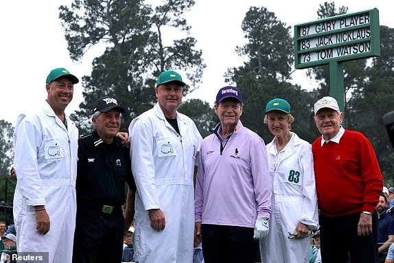 Golf - The Masters - Augusta National Golf Club - Augusta, Georgia, USA - April 6, 2023 Gary Player of South Africa, Tom Watson of the USA and Jack Nicklaus of the USA pose for a photograph with their caddies on the 1st tee during the ceremony begins the first day of play REUTERS/Brian Snyder