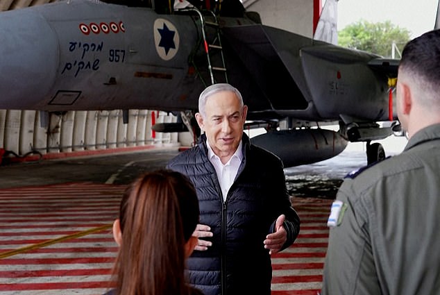 Israel's Prime Minister Benjamin Netanyahu visits an F-15 base on April 11, 2024. Netanyahu appeared to reiterate during the visit that if Iran attacks, Israel will respond 