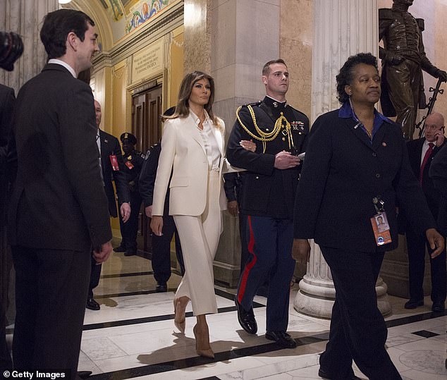Melania Trump, in 2018, shortly after Stormy Daniel's allegations came to light, entered her husband's State of the Union address on the arm of a handsome military aide.