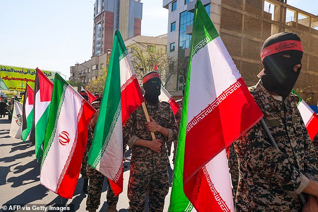 Iranian soldiers attend the funeral procession for seven members of the Islamic Revolutionary Guard Corps killed in an attack in Syria, which Iran blamed on Israel, in Tehran on April 5, 2024.