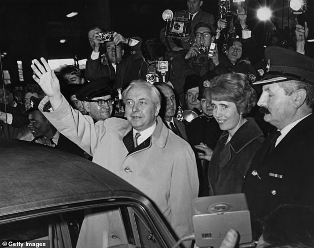 Harold Wilson photographed leaving Euston station on his return from Liverpool in 1966. Seen next to him is his political secretary, Baroness Falkender.