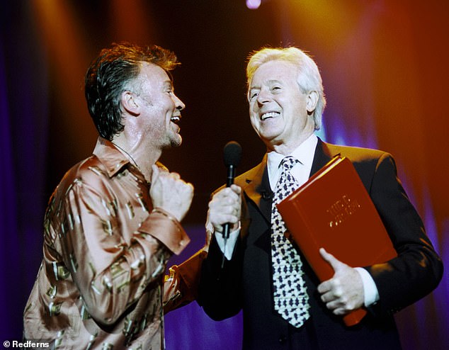 The biographical TV show aired its last series in 2003 and sees the presenter surprise a guest before telling him his life story with the help of a big red book (Michael pictured with Paul Young on the show).