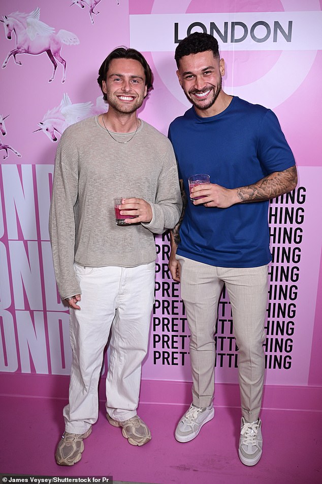 Casey Gorman and Callum Jones smiled as they posed on the pink carpet