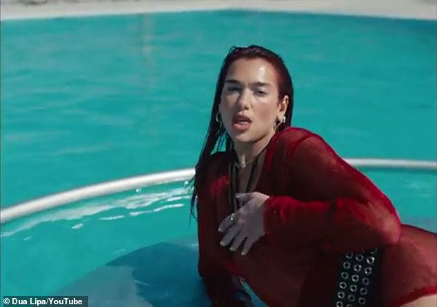 In the video, Lipa and a group of her dancers perform stunts in a large pool with the city skyline in the background.