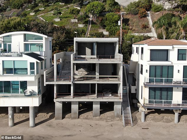 The home, which spans more than 4,000 square feet, has four bedrooms and five bathrooms with idyllic views of the Pacific Ocean, but is missing windows, walls and roof, and has no electricity.