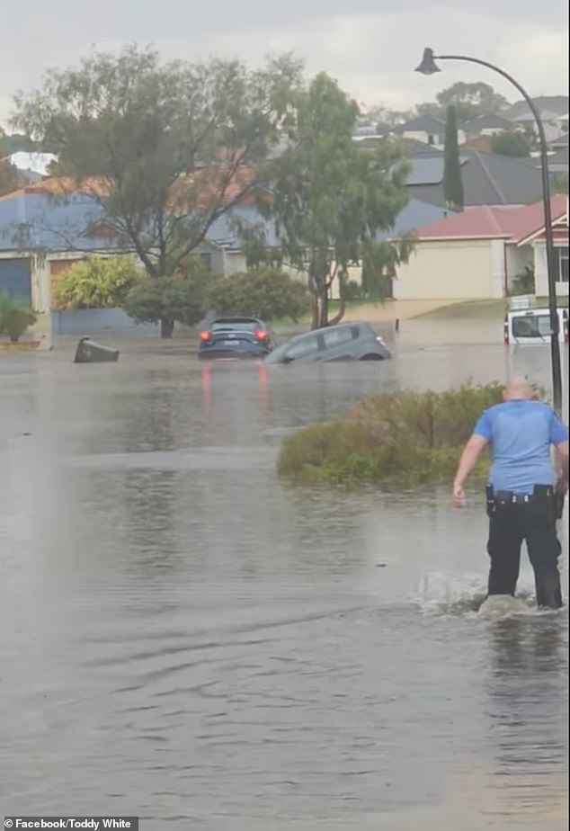 Cars were submerged by floodwaters and drivers were pulled from their affected vehicles as a deluge of rain lashed Perth.