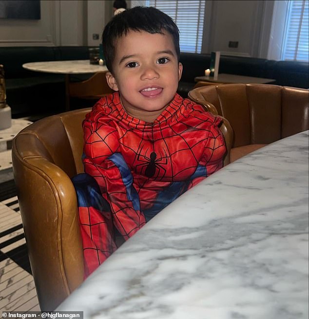 'Football crazy' Charlie sat at a marble table adorably dressed in an original Spider-Man costume.