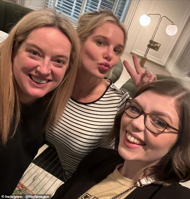 Helen made a peace sign for a selfie with two friends