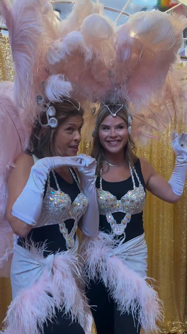 The two women modeled bejeweled bras and feather skirts, as well as matching headpieces.