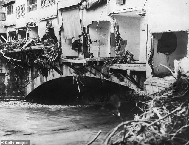 Damaged shops on Florence's Ponte Vecchio after the Arno River overflowed in 1966
