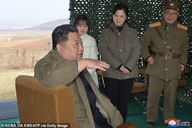 This photo taken on Nov. 18, 2022, and published by North Korea's official Korean Central News Agency (KCNA) shows North Korean leader Kim Jong Un (left) with his wife Ri Sol Ju (second from left). right) and her daughter Ju Ae (second left) as they attend the test launch of the new 'Hwasong Gun 17' type intercontinental ballistic missile (ICBM) in North Korea