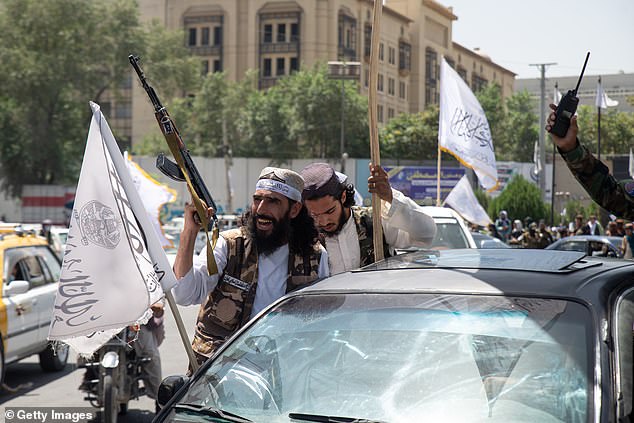 Taliban supporters parade through the streets of Kabul on August 15, 2023 in Kabul