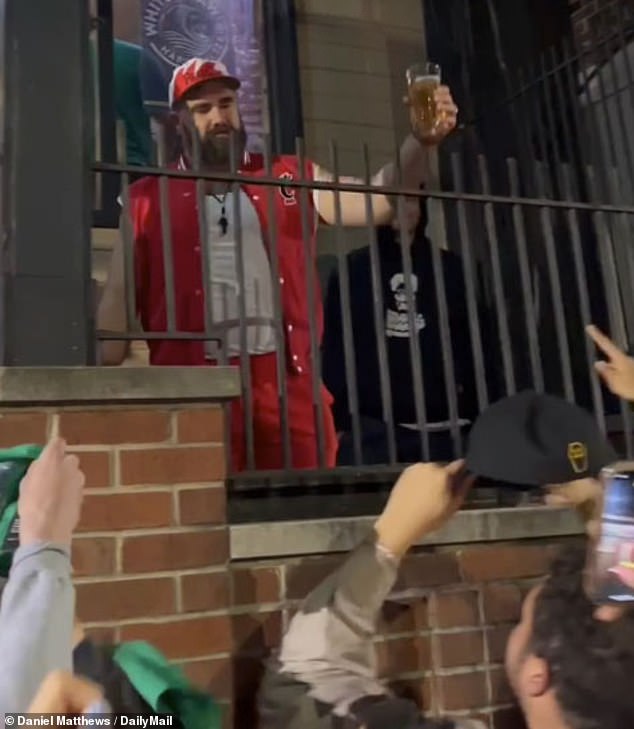 Jason Kelce raises a glass of beer to some members of his former fraternity, Sigma Sigma.