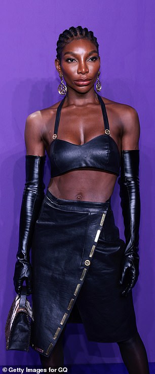 To add more edge to her stunning look, the Netflix sensation added black PVC gloves.