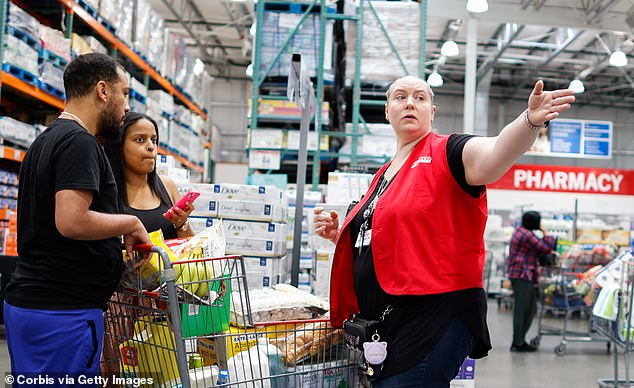 It's unclear whether or not Costco issued a refund for the old Samsung TV.  Pictured is a staff member directing customers at a store in Teterboro, New Jersey.