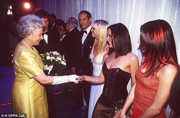 Victoria, known as Posh Spice, and the other Spice Girls meet the Queen after the Royal Variety Performance at the London Palladium in 1997.