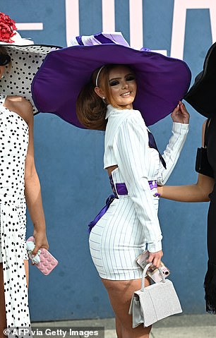 While the Liverpool festival is all about horse racing, today is the day when racing fans will take part in a competition to win the coveted cash prize after being crowned best dressed.
