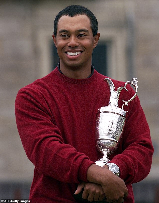 Woods is seen holding the British Open trophy in 2000 in what was a hugely successful year.