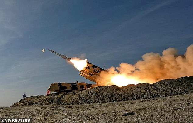 A missile is launched during a military exercise at an undisclosed location in southern Iran, in this image obtained on January 19, 2024.