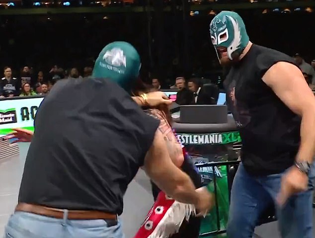Kelce and Johnson appeared with wrestler masks and threw Dominik Mysterio into the ring