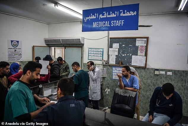 Medical staff and patients at En-Neccar hospital in Rafah, Gaza, on December 27