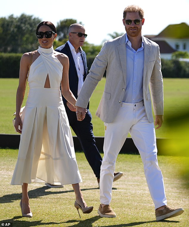 The Duchess of Sussex, 42, braved the grassy terrain in a pair of sky-high nude heels that left her at serious risk of sinking into the ground beneath her.