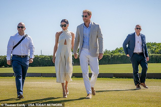 The duo were flanked by burly security guards as they entered the event, which is held at a polo club in Wellington, Florida, near Palm Beach.