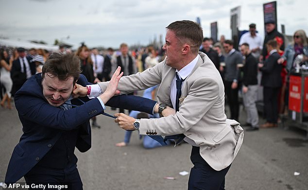 A second image shows the moment another grimacing thug made contact with a rival's left ear.