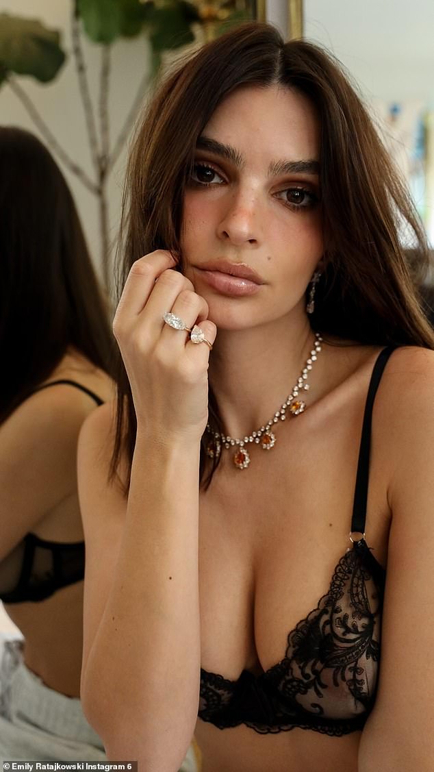 The five-foot-seven model sported stunning silver diamonds on her right hand and casually touched her face to show them off.