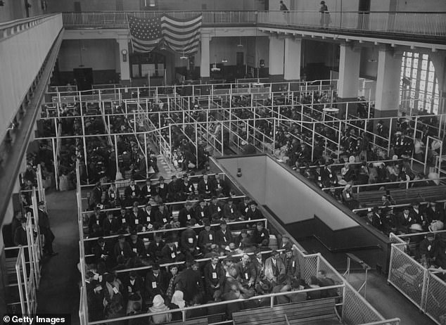 Pictured: The pens in the Ellis Island Registration Room (or Great Hall), all filled with immigrants.