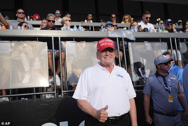 Trump gives a thumbs up as he watches the 18th hole in the final round of the LIV Golf Miami tournament at his club in Doral, Florida, on Sunday, April 7.