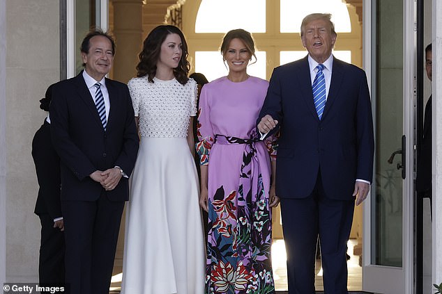 Donald Trump and former first lady Melania Trump visited billionaire investor John Paulson (left) and his wife and fiancee Alina de Almeida at their home in Palm Beach, Florida, on April 6.