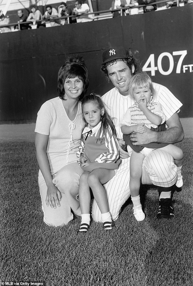 New York Yankees' Mike Kekich and Susanne pose with their daughters before a game