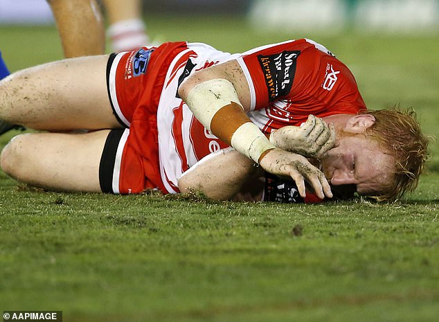 James Graham (pictured, playing for the Dragons) has previously stated that he suffered concussions at least 100 times during his rugby league career and fears he has CTE in the brain, which can only be diagnosed after death.